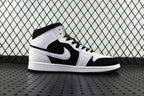 Black and white mid-top sneakers with large Swoosh logo and padded collar