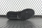 Black rubber outsole for mid-top sneakers with circular traction pattern