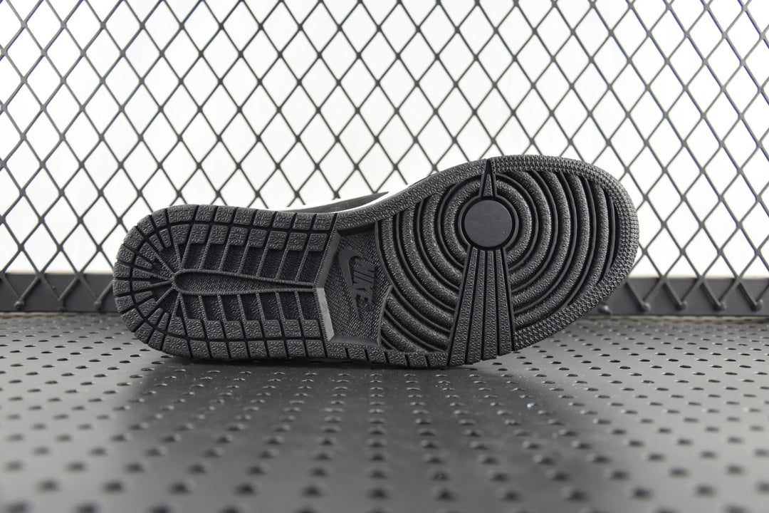 Black rubber outsole for mid-top sneakers with circular traction pattern