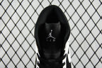 Black heel collar with Air Jordan Air logo and black laces on mid-top sneakers