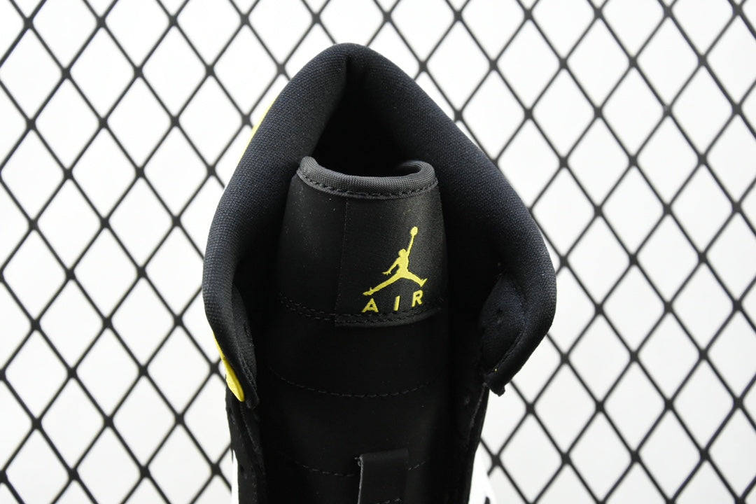 Air Jordan sneaker close-up of black heel with embroidered Air logo in yellow