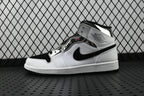 Air Jordan 1 Mid sneakers in white and black, high-top side view with swoosh