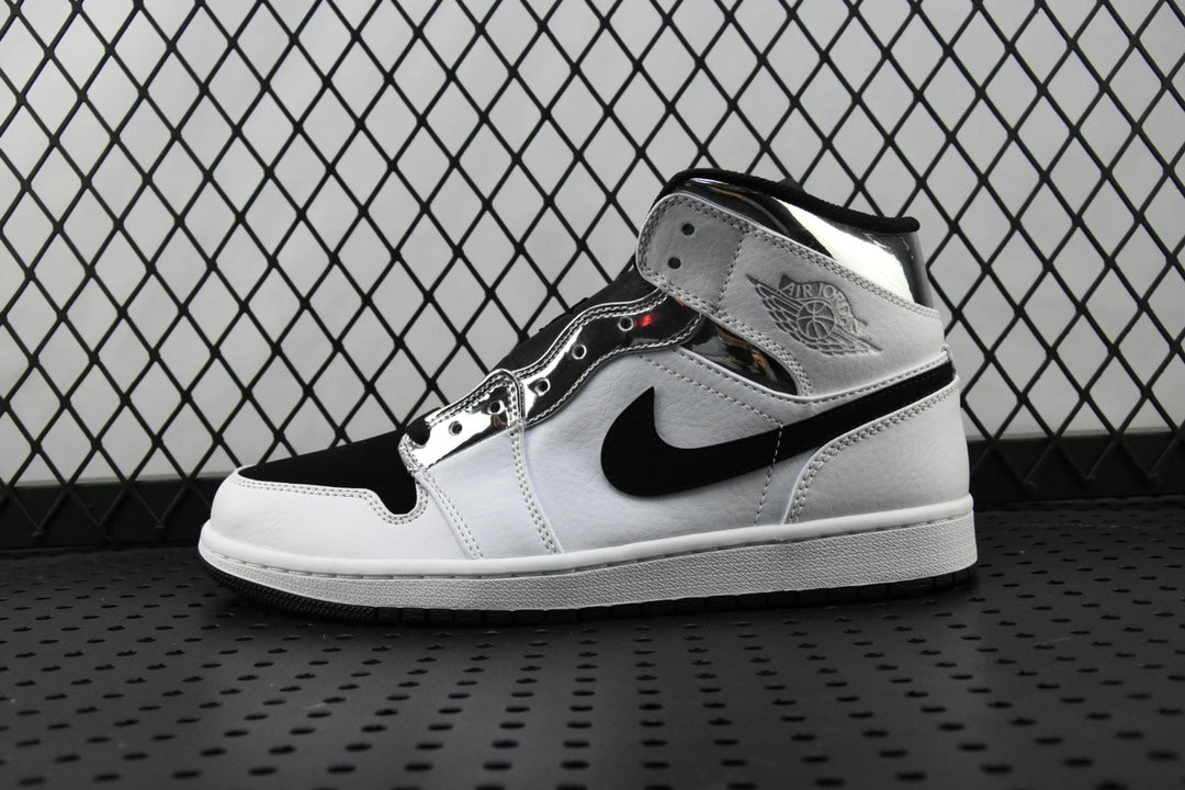 Air Jordan 1 Mid sneakers in white and black, high-top side view with swoosh