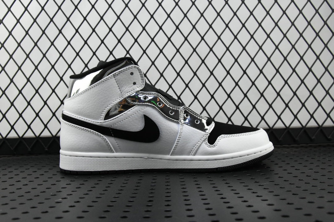 Air Jordan 1 Mid sneakers, white upper with black swoosh and ankle strap, side view