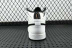Air Jordan 1 Mid sneakers, rear view with white heel and black collar padding