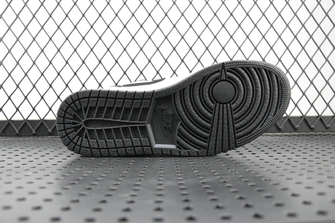 Air Jordan 1 Mid outsole, textured black tread with circular traction pattern