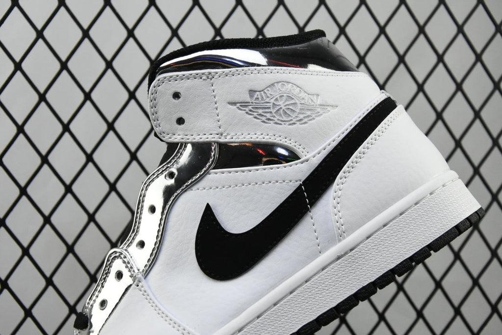 Air Jordan 1 Mid sneakers, white leather with black swoosh stripe and wing eyelets