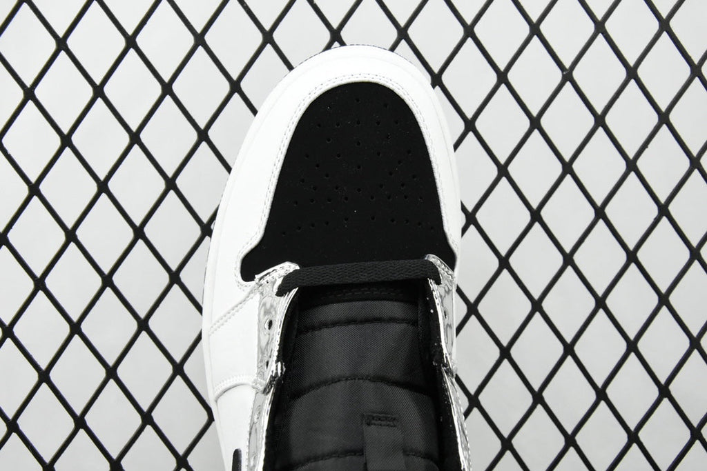 Air Jordan 1 Mid sneakers, front view with black lace and perforated white toe box