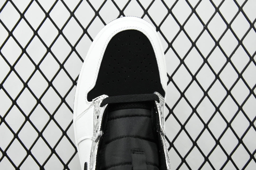 Air Jordan 1 Mid sneakers, front view with black lace and perforated white toe box