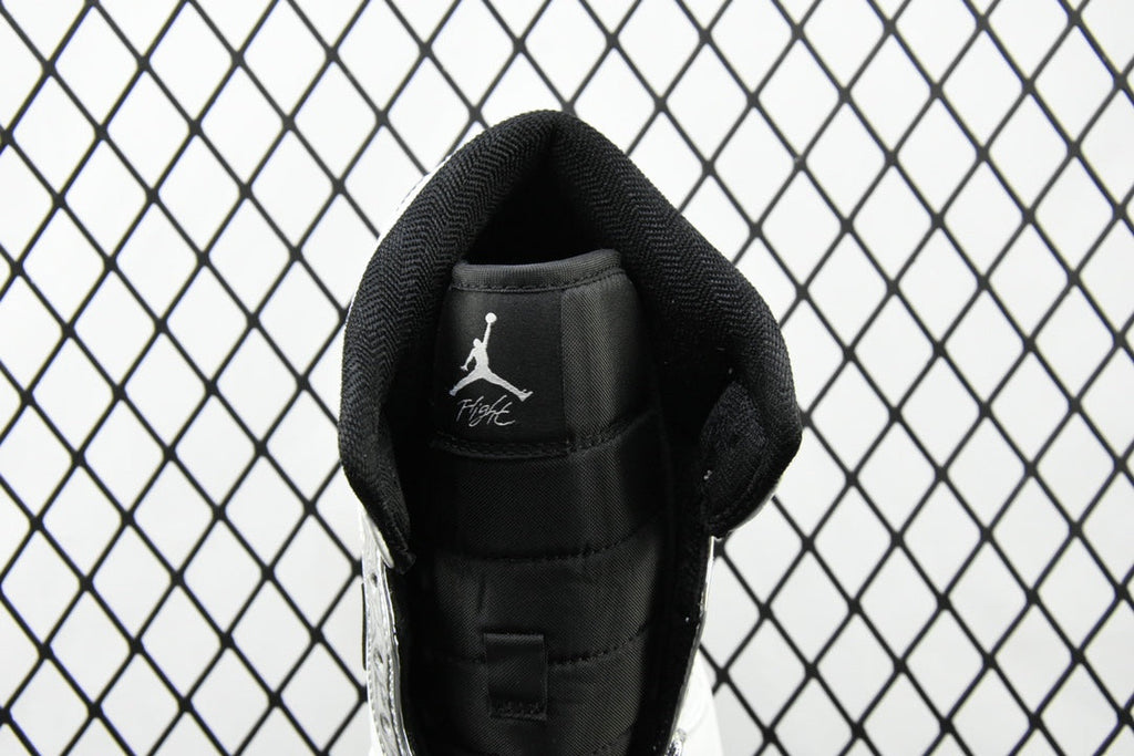 Air Jordan 1 Mid sneakers, heel back with Jumpman logo on black insole lining