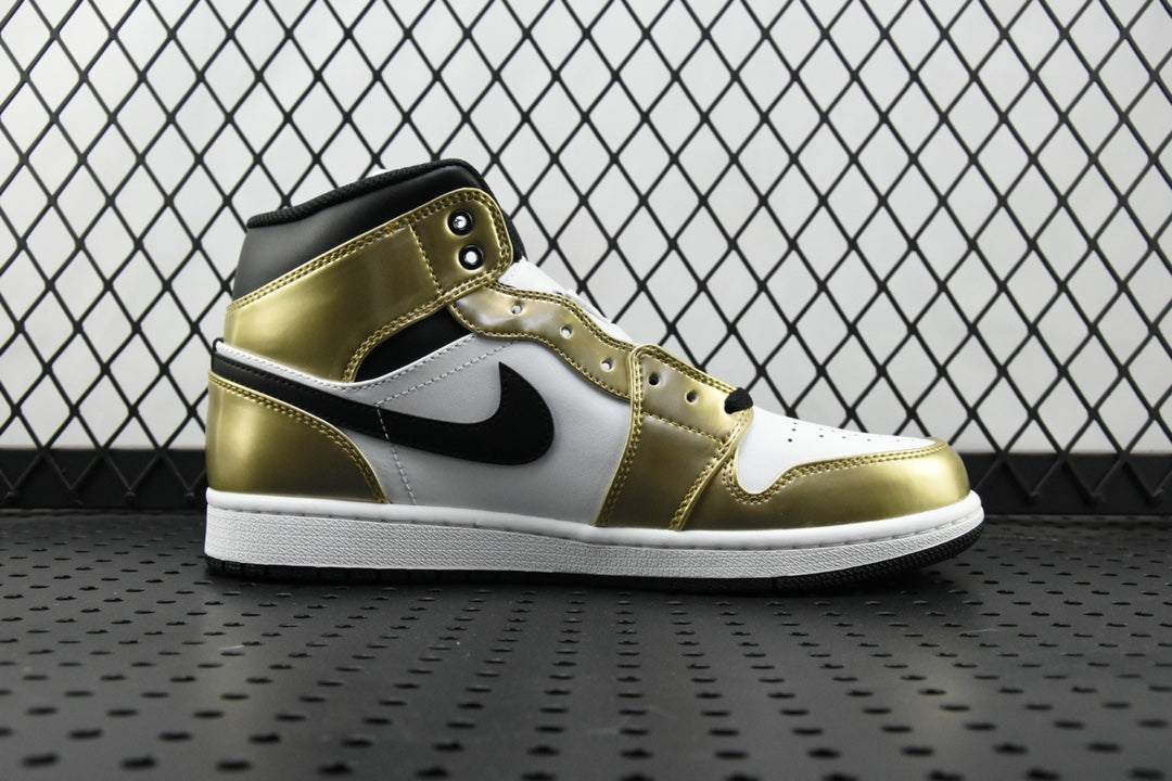 Mid-top Air Jordan sneaker with metallic gold leather, white panels, and black swoosh