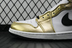 Close-up of mid-top sneaker side: metallic gold and white leather with black swoosh