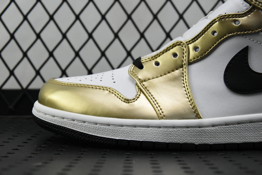 Close-up of mid-top sneaker side: metallic gold and white leather with black swoosh