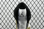 Heel view of mid-top sneaker with AIR Jordan logo on gray lining and metallic gold trim