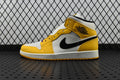 Air Jordan 1 Mid sneakers, yellow and white with black Swoosh, lace-up high-top