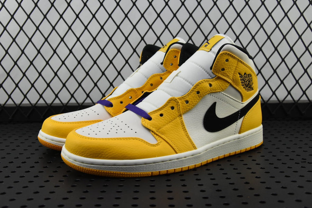 Air Jordan 1 Mid sneakers, white and yellow with black Swoosh and blue accents, lace-up