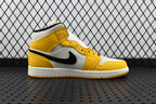 Air Jordan 1 Mid sneakers, yellow leather panels and white overlays with black Swoosh