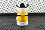 Air Jordan 1 Mid sneakers, white heel with yellow ankle panel and black inner collar