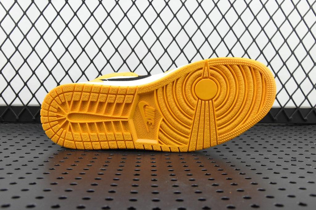 Air Jordan 1 Mid sneakers, yellow rubber outsole with textured tread pattern