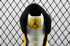 Air Jordan 1 Mid sneakers, white heel with Air Jordan Air logo on black collar, yellow sides