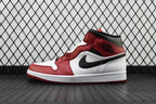 Mid-top leather sneaker in red, white, and black with a visible side swoosh