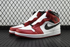 Mid-top sneaker with red and white panels and black swoosh detail