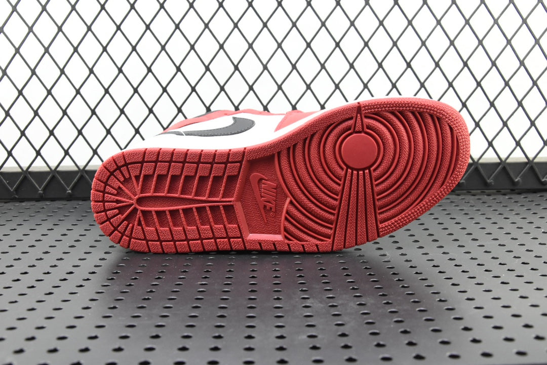 Red rubber outsole tread for a mid-top sneaker
