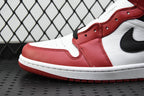 Close-up of mid-top sneaker toe and side panel in red, white, and black