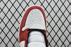 Mid-top sneaker toe cap view with perforations and red trim