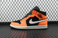 Mid-top sneakers in orange, black, and white with black collar and white swoosh