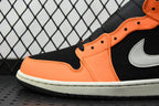 Close-up of side panel with orange leather, black trim, and a white swoosh