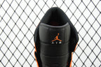 Heel view of mid-top sneaker with black leather and orange AIR branding