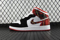 Mid-top sneakers with white and black panels, red plaid collar, and red outsole