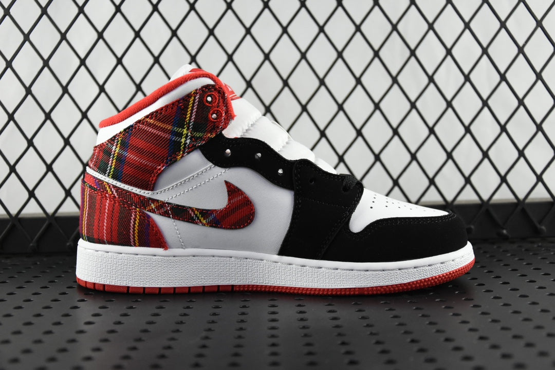 Mid-top sneakers with white leather panels, black overlays, and red plaid collar detail