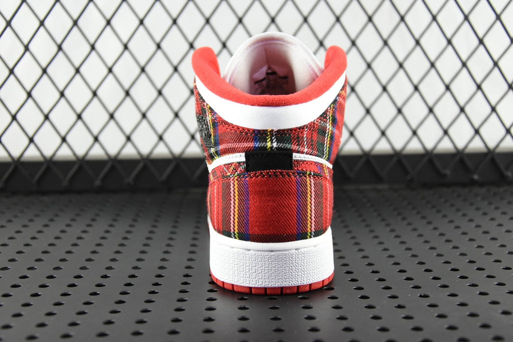 Mid-top sneakers heel view with red plaid collar, black tongue, and white back panel