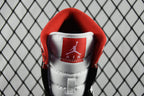 Mid-top sneakers with red collar lining and Air Jordan logo on white tongue