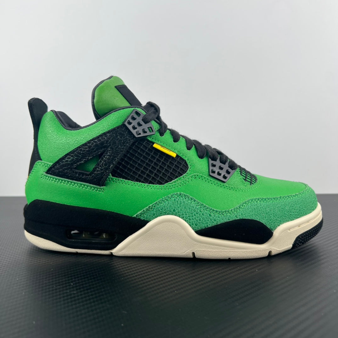 Green and black Air Jordan 4 sneaker with black lace panel and white midsole