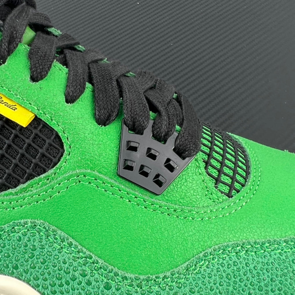 Neon green lace-up sneaker with black heel cage and textured quarter panel