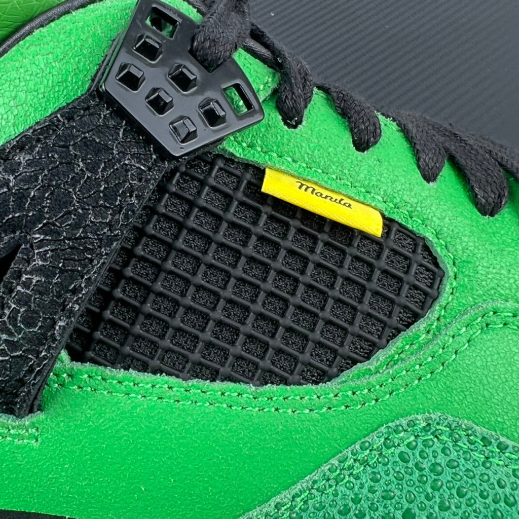 Neon green sneaker with black textured mudguard and yellow branding stripe