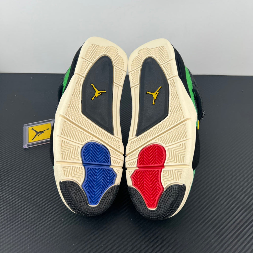 Air Jordan 4 sneaker outsoles showing cream tread with red and blue inserts