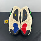 Air Jordan 4 sneaker outsoles showing cream tread with red and blue inserts