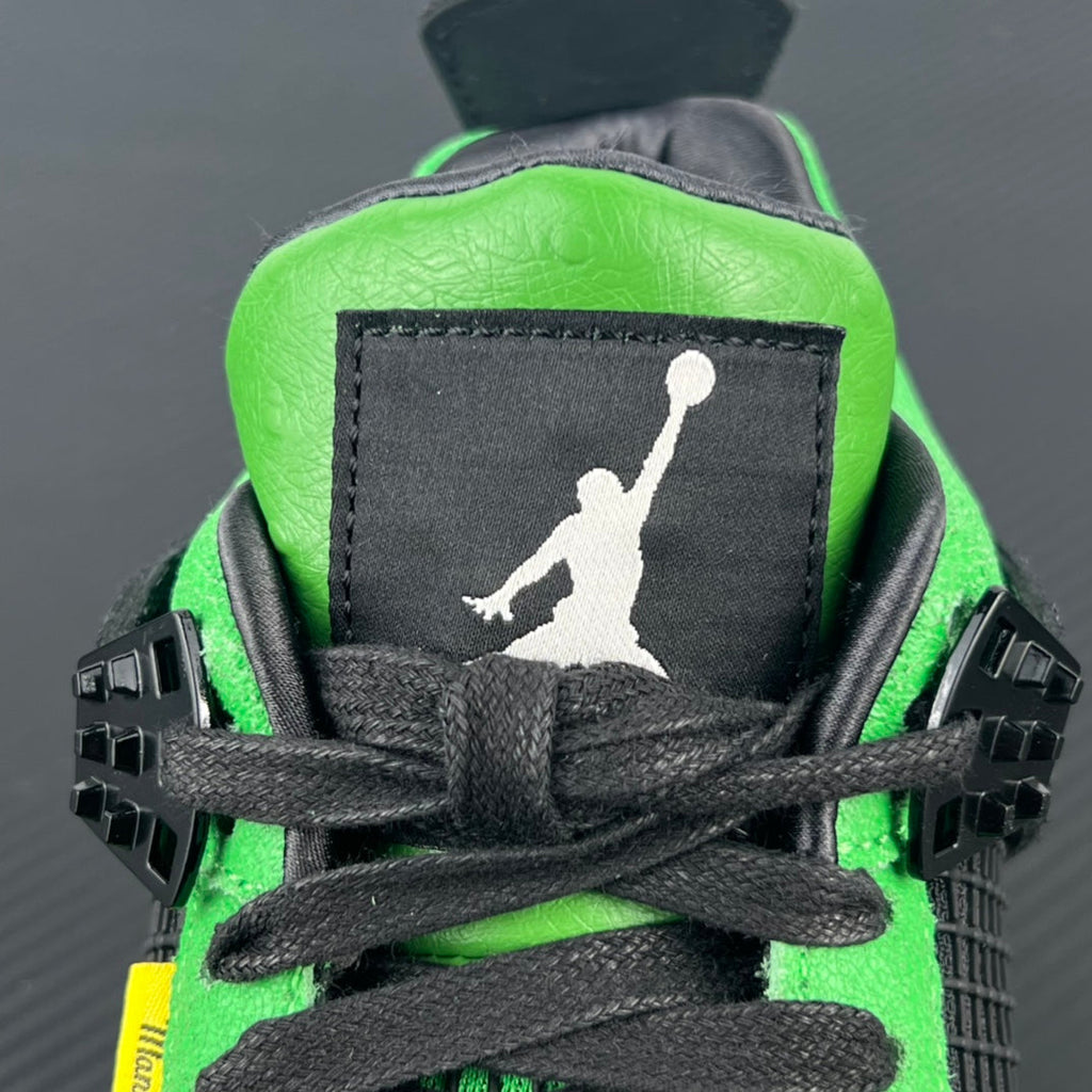 Neon green and black heel with Jumpman logo on black fabric patch