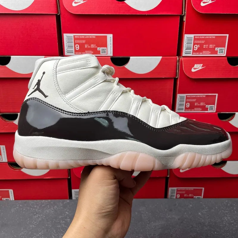 White and black high-top lace-up sneaker with glossy black panel and Jumpman logo