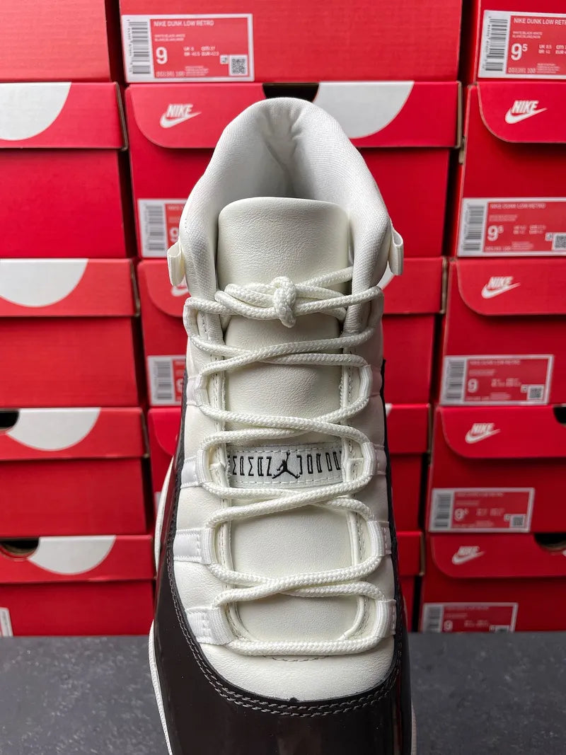 White high-top lace-up sneaker with padded heel and woven tongue area