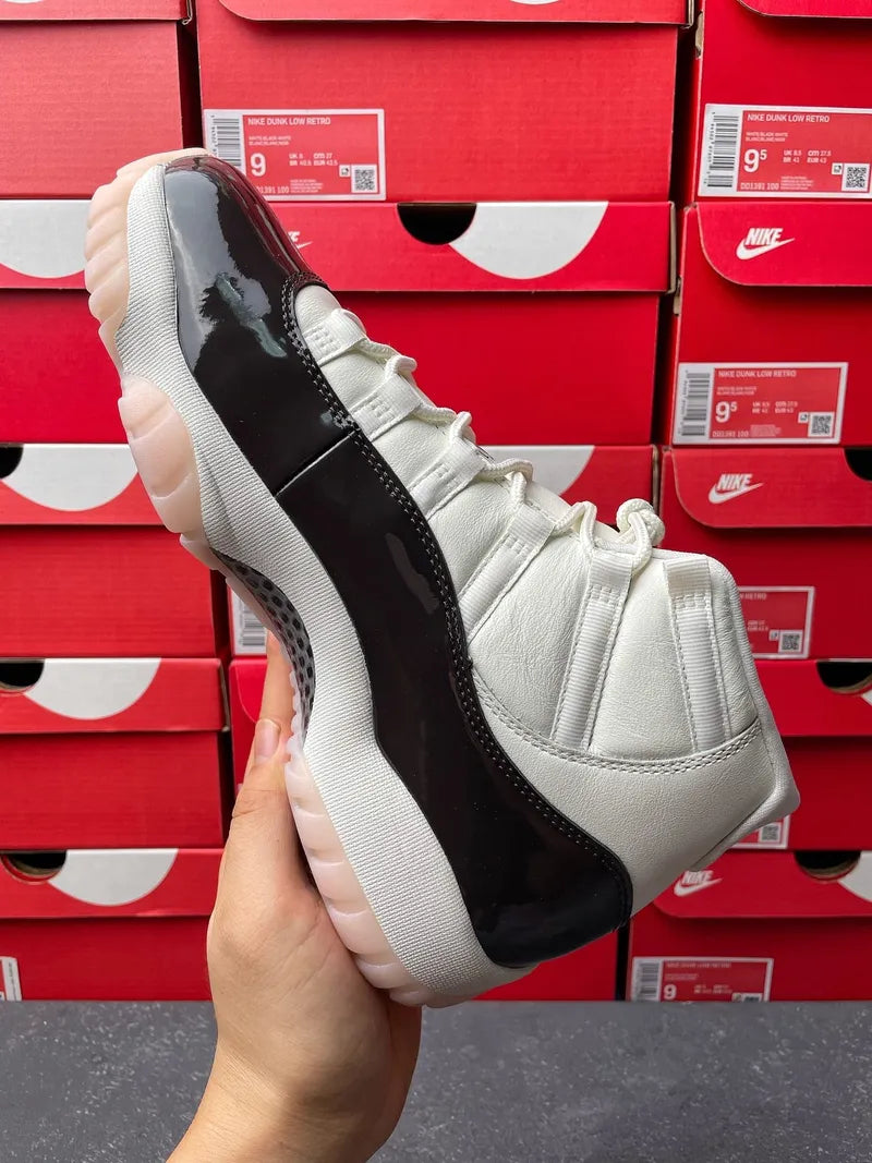 White and black high-top lace-up sneaker with glossy black side stripe and logo