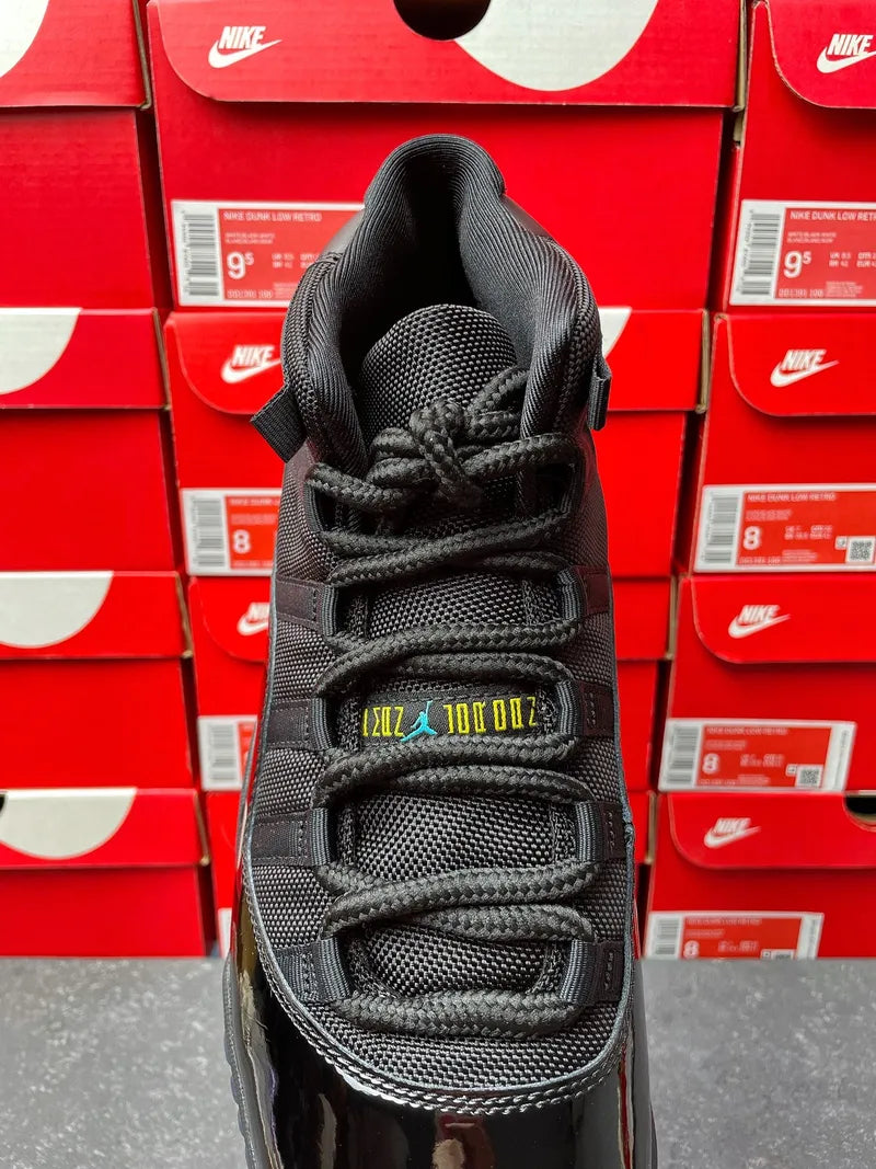 Black high-top sneaker with lace-up front and visible toe mesh