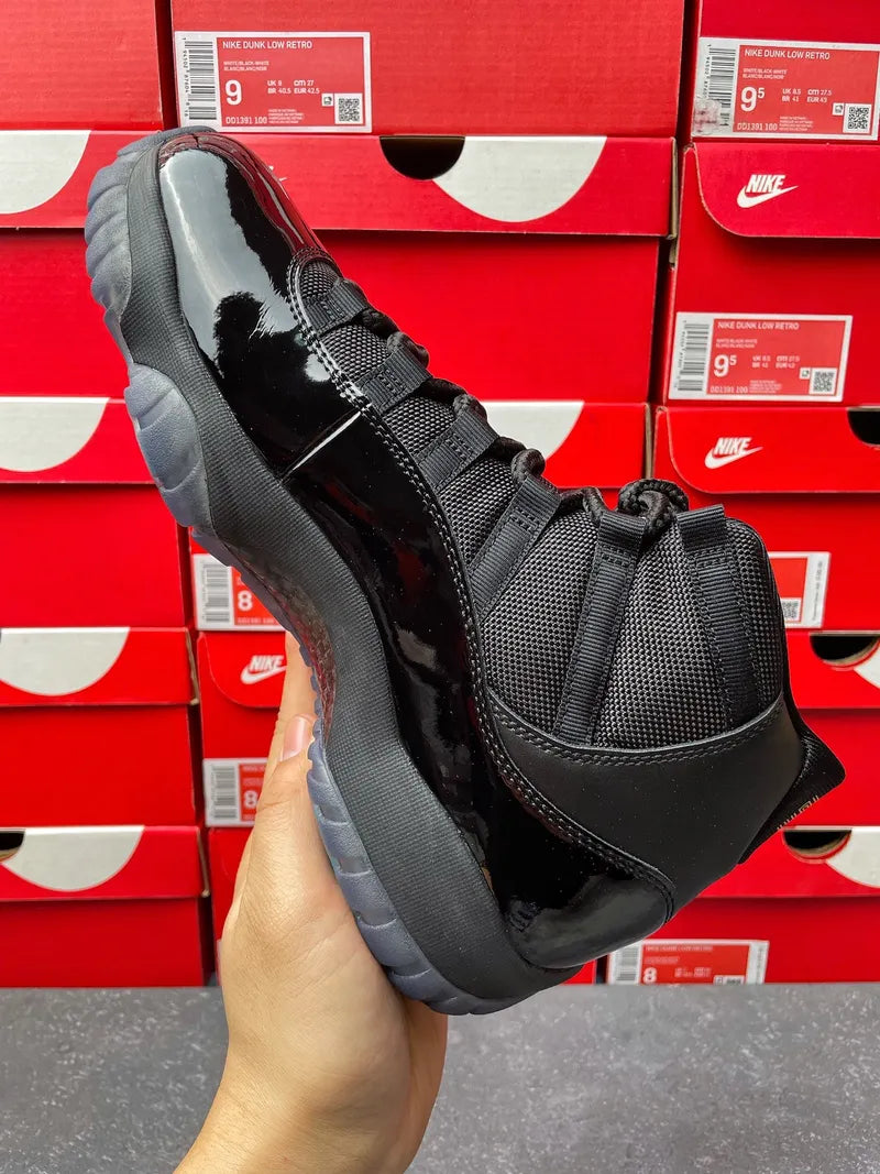 Black high-top sneaker with glossy trim and textured mesh on side