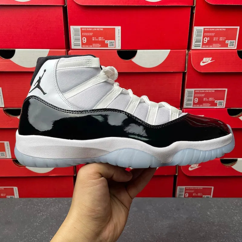 Air Jordan 11 sneakers, white mesh upper with black patent side panel and light blue sole