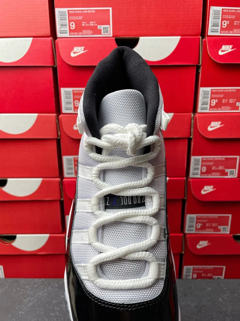 Air Jordan 11 sneakers, back view with black heel and white laces