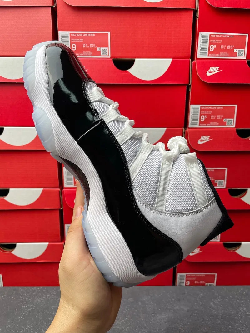 Air Jordan 11 sneakers, other side view with white mesh upper and black patent stripe